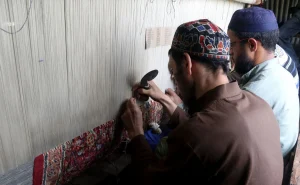 Kashmiri rug carpenters at work, credit- Greater Kashmir.